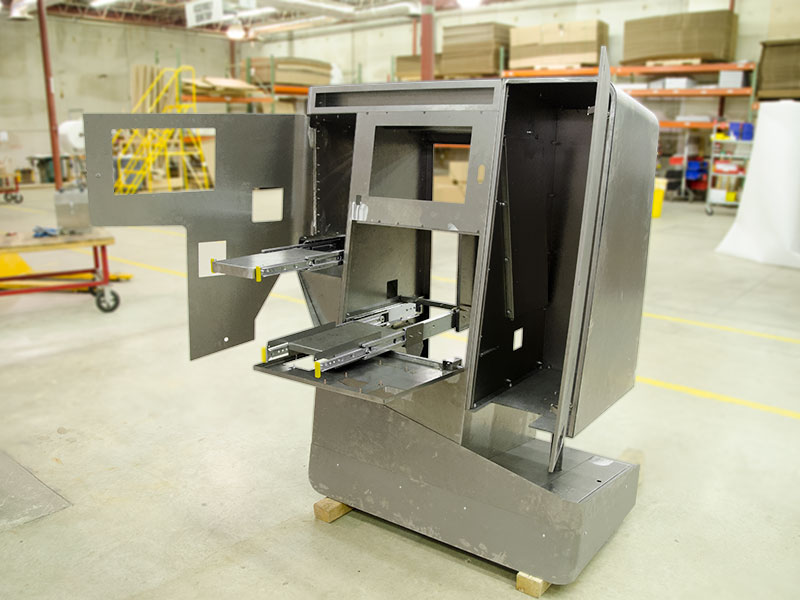 Movable components are rigorously tested on a kiosk before finishing touches.