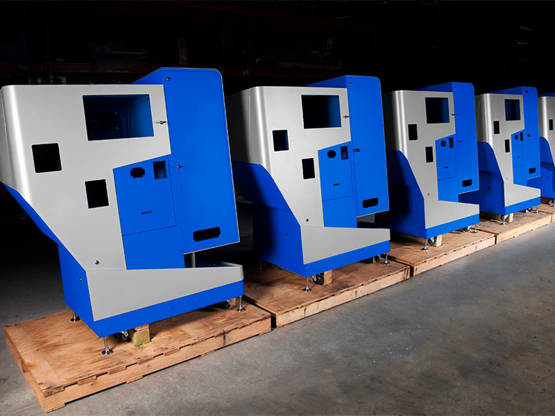 Fully-assembled kiosks are ready for screens and other final components before they are packaged for shipping.